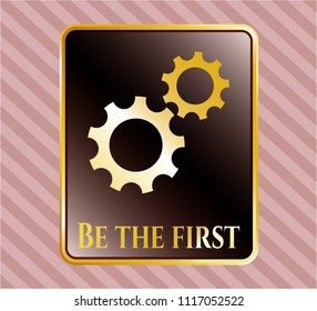  Gold emblem or badge with gear, team work icon and Be the first text inside