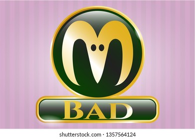  Gold emblem or badge with goat head icon and Bad text inside