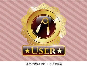 Gold emblem or badge with hand gripper icon and User text inside