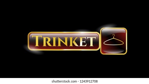  Gold emblem or badge with hanger icon and Trinket text inside