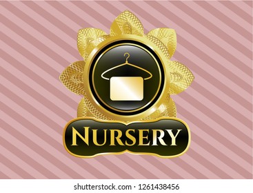  Gold emblem or badge with hanger with towel icon and Nursery text inside