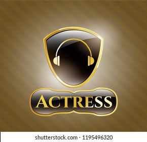  Gold emblem or badge with headphones icon and Actress text inside