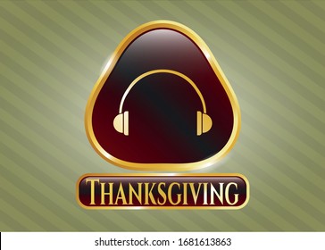  Gold emblem or badge with headphones icon and Thanksgiving text inside