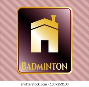  Gold emblem or badge with house icon and Badminton text inside