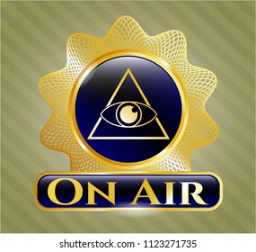  Gold emblem or badge with illuminati pyramid icon and On Air text inside