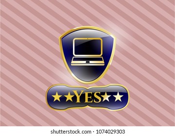   Gold emblem or badge with laptop icon and Yes text inside