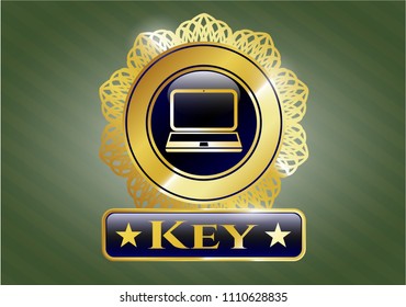 Gold emblem or badge with laptop icon and Key text inside