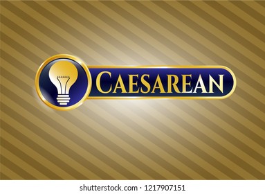  Gold emblem or badge with light bulb icon and Caesarean text inside