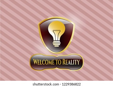  Gold emblem or badge with light bulb icon and Welcome to Reality text inside