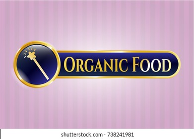  Gold emblem or badge with magic stick icon and Organic Food text inside