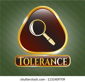  Gold emblem or badge with magnifying glass icon and Tolerance text inside