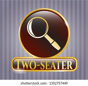  Gold emblem or badge with magnifying glass icon and Two-seater text inside