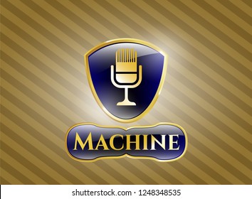  Gold emblem or badge with microphone icon and Machine text inside