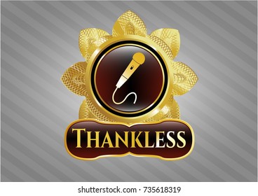 Gold emblem or badge with microphone icon and Thankless text inside