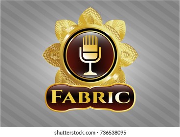 Gold emblem or badge with microphone icon and Fabric text inside