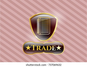  Gold emblem or badge with note book icon and Trade text inside