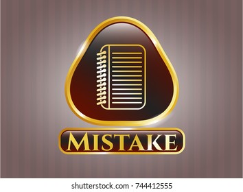  Gold emblem or badge with note book icon and Mistake text inside