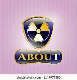  Gold emblem or badge with nuclear, radioactive icon and About text inside