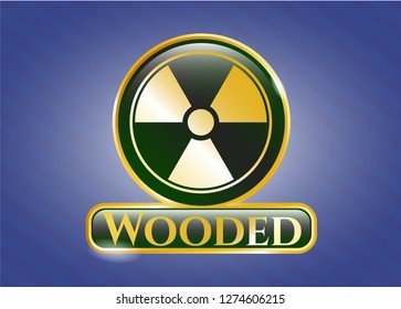  Gold emblem or badge with nuclear, radioactive icon and Wooded text inside