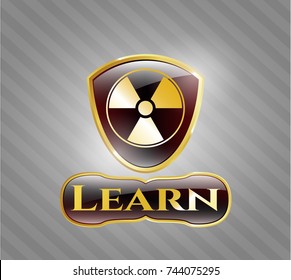  Gold emblem or badge with nuclear, radioactive icon and Learn text inside