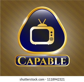  Gold emblem or badge with old tv, television icon and Capable text inside