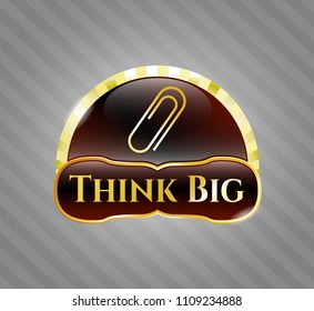  Gold emblem or badge with paper clip icon and Think Big text inside