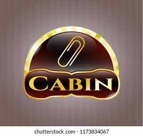  Gold emblem or badge with paper clip icon and Cabin text inside