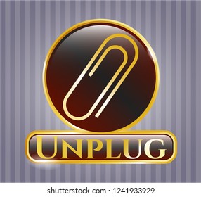  Gold emblem or badge with paper clip icon and Unplug text inside