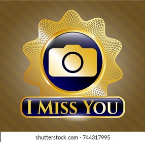 Gold emblem or badge with photo camera icon and I Miss You text inside