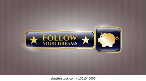  Gold emblem or badge with piggy bank icon and Follow your dreams text inside