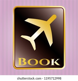  Gold emblem or badge with plane icon and Book text inside