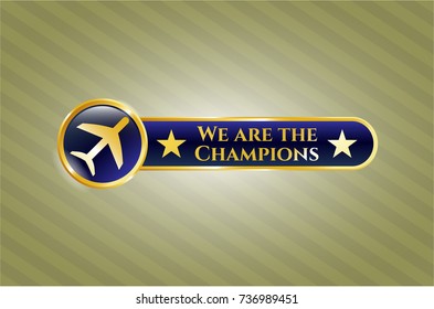  Gold emblem or badge with plane icon and We are the Champions text inside