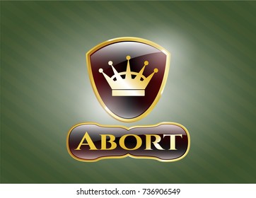  Gold emblem or badge with queen crown icon and Abort text inside