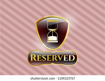   Gold emblem or badge with sand clock icon and Reserved text inside