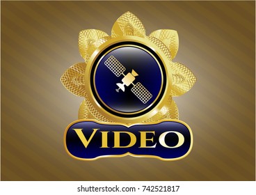  Gold emblem or badge with satelite icon and Video text inside