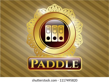  Gold emblem or badge with three folders icon and Paddle text inside