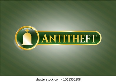   Gold emblem or badge with tombstone icon and Antitheft text inside