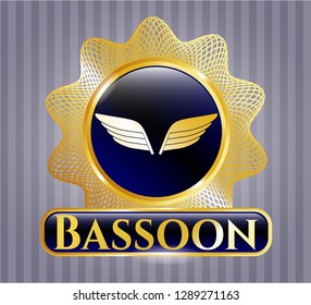  Gold emblem or badge with wings icon and Bassoon text inside