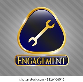  Gold emblem or badge with wrench icon and Engagement text inside