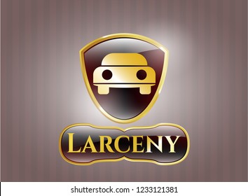  Gold emblem with car seen from front icon and Larceny text inside