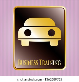  Gold emblem with car seen from front icon and Business Training text inside