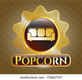  Gold emblem with couch icon and Popcorn text inside