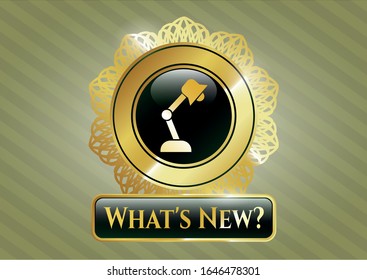  Gold emblem with desk lamp icon and What's New? text inside