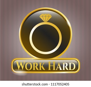  Gold emblem with diamond ring icon and Work Hard text inside