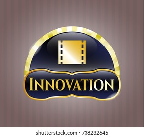  Gold emblem with film icon and Innovation text inside