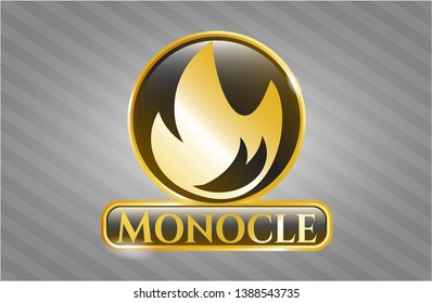  Gold emblem with fire icon and Monocle text inside