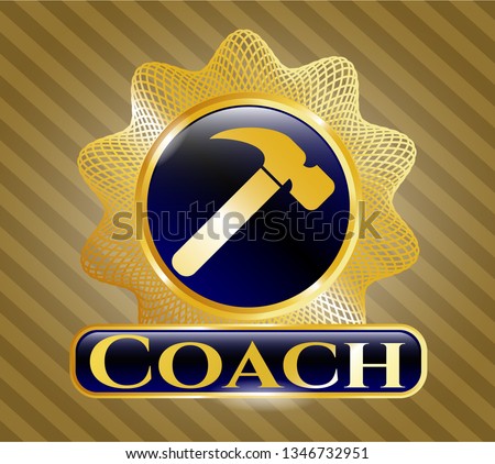  Gold emblem with hammer icon and Coach text inside
