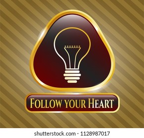  Gold emblem with idea icon and Follow your Heart text inside