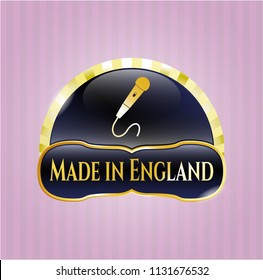  Gold emblem with microphone icon and Made in England text inside