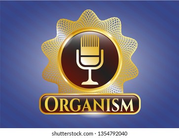  Gold emblem with microphone icon and Organism text inside